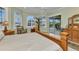 Main bedroom features a large window with a sliding door leading to the outdoor pool at 15490 Seafoam Cir, Port Charlotte, FL 33981