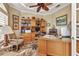 Inviting home office with custom built-ins, desk, and ample natural light, perfect for working from home at 15490 Seafoam Cir, Port Charlotte, FL 33981
