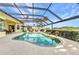 Screened-in pool area with lovely water views and ample space for entertaining at 15490 Seafoam Cir, Port Charlotte, FL 33981