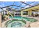 Sparkling pool and hot tub with easy access to the home's interior at 15490 Seafoam Cir, Port Charlotte, FL 33981