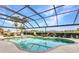 Pool and waterfront view seen from the covered patio at 15490 Seafoam Cir, Port Charlotte, FL 33981