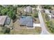 Aerial view of a home with a screened pool, lush greenery, and a private backyard at 1556 Eagle St, Port Charlotte, FL 33952