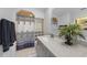 Bright bathroom with a patterned shower curtain, glass block detail, and modern vanity with white countertop at 1556 Eagle St, Port Charlotte, FL 33952