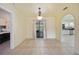 Bright dining room with access to kitchen and sliding door at 1556 Eagle St, Port Charlotte, FL 33952