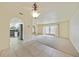 Inviting living area with view into the kitchen, tile floors, and neutral walls at 1556 Eagle St, Port Charlotte, FL 33952
