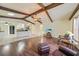 Open floor plan with high vaulted ceilings, wood beams and wood floors at 1556 Eagle St, Port Charlotte, FL 33952