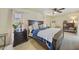 Main bedroom with tile flooring and two windows with drapes at 1556 Eagle St, Port Charlotte, FL 33952
