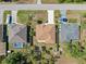 An overhead view of neighboring houses, one with a backyard swimming pool at 16450 Bauers Ave, Port Charlotte, FL 33954