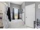 Modern bathroom with a marble tile soaking tub under an arched window and a separate shower at 16450 Bauers Ave, Port Charlotte, FL 33954