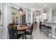 Open-concept dining area featuring bar seating and sliding door access at 16450 Bauers Ave, Port Charlotte, FL 33954