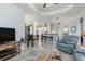 Open living space showcasing a combined kitchen, living, and dining area with tile flooring at 16450 Bauers Ave, Port Charlotte, FL 33954
