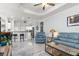 Open living space combining kitchen, living room, and bar seating at 16450 Bauers Ave, Port Charlotte, FL 33954