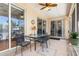Covered patio features tile flooring, ceiling fan and a table with 4 chairs at 16450 Bauers Ave, Port Charlotte, FL 33954