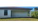 Large covered outdoor patio area provides shade and privacy for relaxing or entertaining guests at 17374 Gadsen Ave, Port Charlotte, FL 33948