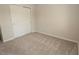 Bedroom features sliding door closet and neutral carpet at 17374 Gadsen Ave, Port Charlotte, FL 33948