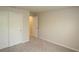 Bedroom features sliding door closet and neutral carpet at 17374 Gadsen Ave, Port Charlotte, FL 33948