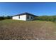 New construction home with simple landscaping and a large private backyard at 17374 Gadsen Ave, Port Charlotte, FL 33948