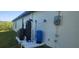Exterior view of home's water and filtration systems, highlighting functionality at 17374 Gadsen Ave, Port Charlotte, FL 33948
