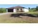 Well maintained single Gathering home with attached two car garage and manicured lawn at 17374 Gadsen Ave, Port Charlotte, FL 33948