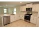 Open kitchen featuring stainless steel appliances, white cabinets, quartz counters and recessed lighting at 17374 Gadsen Ave, Port Charlotte, FL 33948
