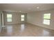 Spacious living room with tile flooring, natural light, and neutral walls at 17374 Gadsen Ave, Port Charlotte, FL 33948