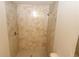 Bathroom features a tiled walk-in shower with modern fixtures at 17374 Gadsen Ave, Port Charlotte, FL 33948