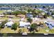 This waterfront home has a long dock with water access and lush green surroundings at 182 Dowling Ne Ave, Port Charlotte, FL 33952