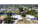 Aerial view of the waterfront property featuring a canal and a private dock at 182 Dowling Ne Ave, Port Charlotte, FL 33952