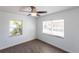 Bright bedroom featuring hardwood floors and lots of natural light from the windows at 182 Dowling Ne Ave, Port Charlotte, FL 33952