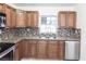 Kitchen showcasing granite countertops, stainless steel appliances, and ample cabinet space at 182 Dowling Ne Ave, Port Charlotte, FL 33952