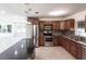 Modern kitchen featuring stainless steel appliances, granite countertops, and a sleek island at 182 Dowling Ne Ave, Port Charlotte, FL 33952