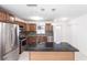 Updated kitchen with stainless steel appliances, granite countertops, and center island at 182 Dowling Ne Ave, Port Charlotte, FL 33952