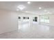 Bright, spacious living room featuring recessed lighting and large windows offering natural light at 182 Dowling Ne Ave, Port Charlotte, FL 33952