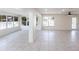 Open living area with recessed lighting, ceiling fan, and tile flooring, full of natural light at 182 Dowling Ne Ave, Port Charlotte, FL 33952