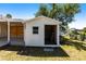 Outdoor storage shed with an open doorway, providing convenient storage for tools and equipment at 182 Dowling Ne Ave, Port Charlotte, FL 33952