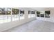 Bright sun room with tile flooring, lots of natural light, and water views from multiple windows at 182 Dowling Ne Ave, Port Charlotte, FL 33952