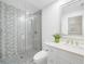 Bathroom featuring a tiled shower, white toilet, vanity, and decor at 1820 Jamaica Way, Punta Gorda, FL 33950