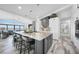 Gourmet kitchen with a large island, bar stools, and access to outside view at 1820 Jamaica Way, Punta Gorda, FL 33950