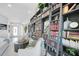 Inviting living room with a floor-to-ceiling bookshelf offering a cozy and cultured atmosphere at 1820 Jamaica Way, Punta Gorda, FL 33950