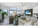 Comfortable living room with vaulted ceilings, large windows, and water views at 1820 Jamaica Way, Punta Gorda, FL 33950
