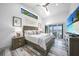 Bright main bedroom boasts vaulted ceiling, transom window and access to outdoor space at 1820 Jamaica Way, Punta Gorda, FL 33950