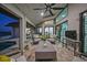 Covered patio features brick flooring, ceiling fan, outdoor seating, and sunset views at 1820 Jamaica Way, Punta Gorda, FL 33950