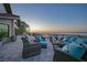 A waterfront patio that features comfortable seating perfect for enjoying ocean sunsets at 1820 Jamaica Way, Punta Gorda, FL 33950