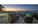 Waterfront patio featuring comfortable seating and beautiful views of the ocean at sunset at 1820 Jamaica Way, Punta Gorda, FL 33950