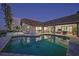 Private pool and patio area, perfect for outdoor entertaining with tranquil waterfront views at twilight at 1820 Jamaica Way, Punta Gorda, FL 33950