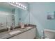 Bright bathroom with double vanity, granite countertop, framed mirror, and tub-shower combination at 19375 Water Oak Dr # 106, Port Charlotte, FL 33948