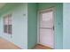 Condo entrance featuring unit number 106, a storm door, and a window by the front door at 19375 Water Oak Dr # 106, Port Charlotte, FL 33948