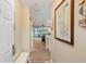 Inviting foyer view with light-colored walls, a scenic wall map, and entry to the living space at 19375 Water Oak Dr # 106, Port Charlotte, FL 33948