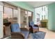 Inviting lanai with seating overlooking the waterfront and scenic views with sliding glass doors to the home at 19375 Water Oak Dr # 106, Port Charlotte, FL 33948