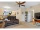 Open concept living space featuring seamless access to the dining and kitchen areas, promoting effortless socializing at 19375 Water Oak Dr # 106, Port Charlotte, FL 33948